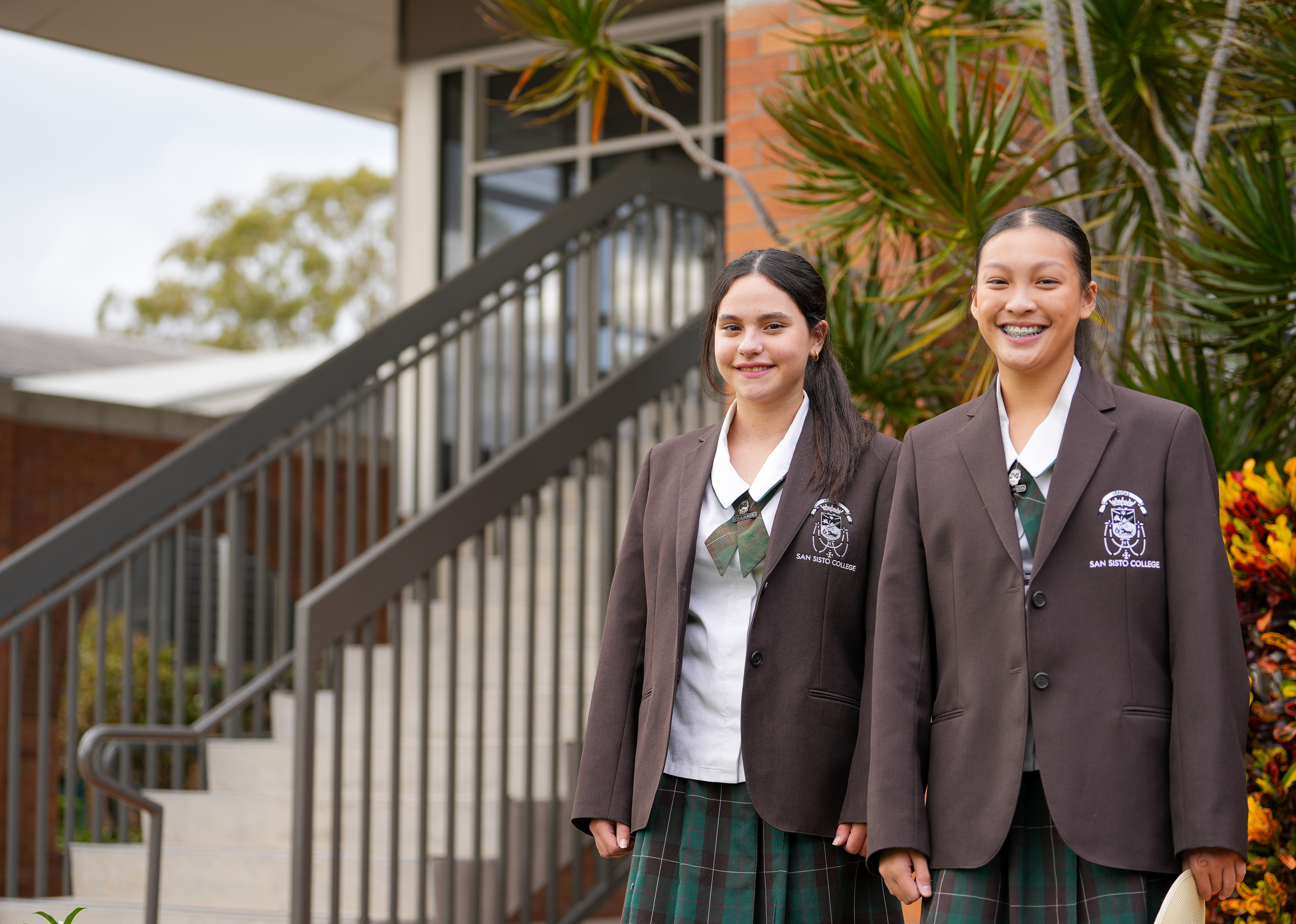 2 individuals at front of san sisto college